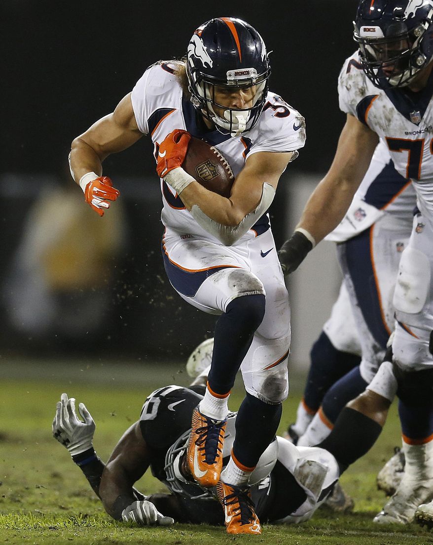 Denver Broncos running back Phillip Lindsay runs against the Oakland Raiders during the first half of an NFL football game in Oakland, Calif., Monday, Dec. 24, 2018. (AP Photo/D. Ross Cameron)
