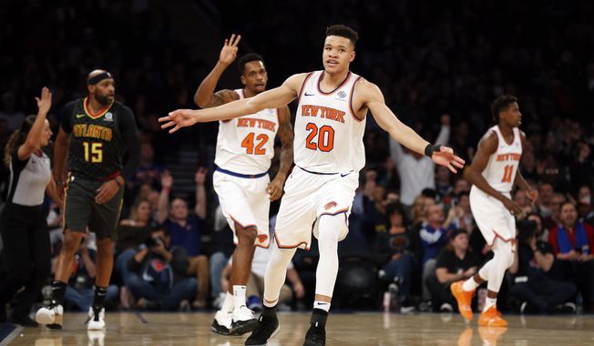 New York Knicks forward Kevin Knox (20) celebrates after making a 3-point basket against the Atlanta Hawks during the first half of an NBA basketball game Friday, Dec. 21, 2018, in New York. (AP Photo/Adam Hunger)