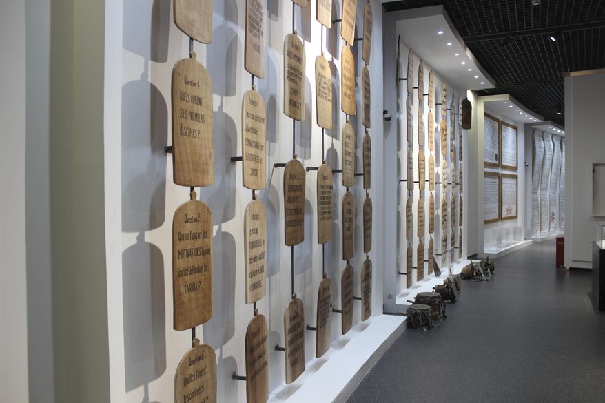 In this photo taken Thursday, Dec. 20, 2018, a wall of Quranic inscriptions hangs in a gallery dedicated to Abrahamic religions in Africa, seen in a Museum of Black Civilizations in Dakar, Senegal. The new museum in Dakar is the latest sign that welcoming spaces across the continent are being prepared. Focusing on Africa and its diaspora, it has been decades in the making. (AP Photo/Amelia Nierenberg)