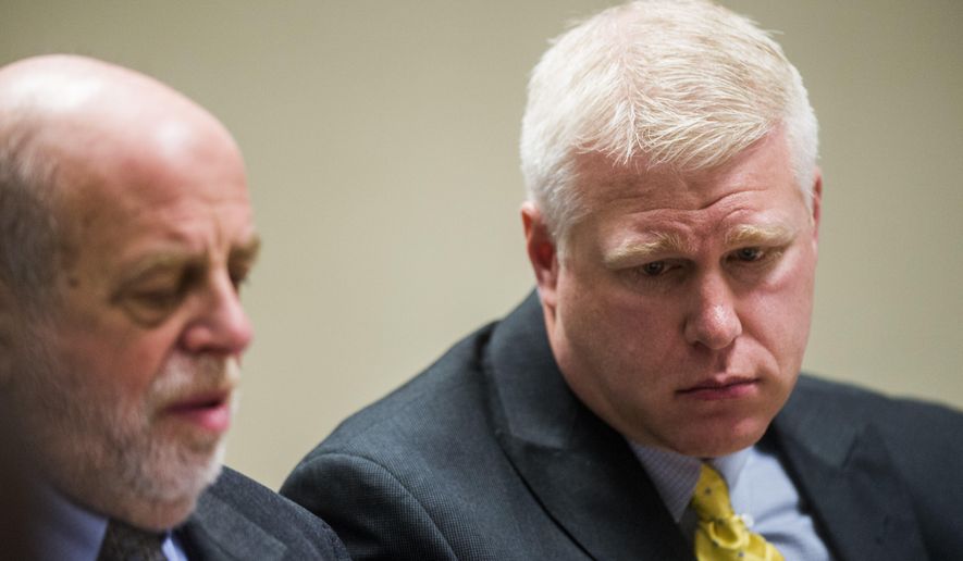 FILE - In this Jan. 10, 2018, file photo, Defendant Stephen Busch, right, listens at Flint District Court in Flint, Mich. Michael Prysby and Busch, two Michigan environmental regulators implicated in the Flint water scandal, have pleaded no contest to misdemeanors in exchange for more serious charges being dropped. (Jake May/The Flint Journal via AP, File)/
