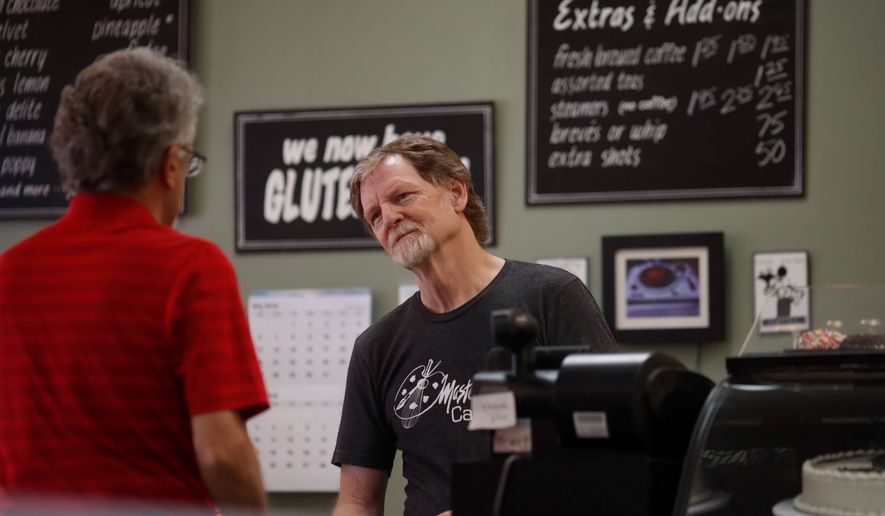 Baker Jack Phillips, owner of Masterpiece Cakeshop, manages his shop after the U.S. Supreme Court ruled that he could refuse to make a wedding cake for a same-sex couple because of his religious beliefs did not violate Colorado&#x27;s anti-discrimination law Monday, June 4, 2018, in Lakewood, Colo. (AP Photo/David Zalubowski) ** FILE **
