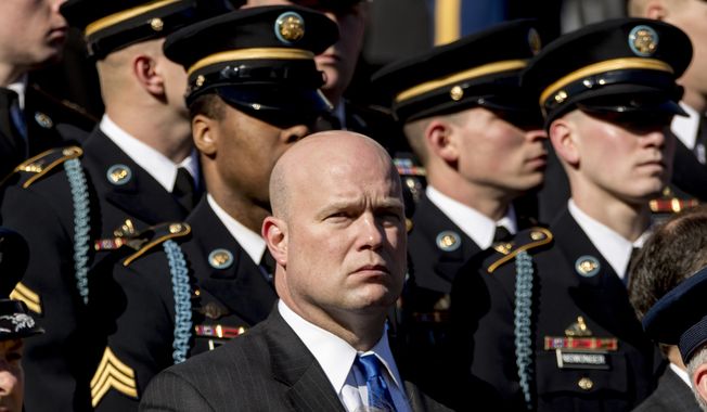 Acting United States Attorney General Matt Whitaker, center, attends a wreath laying ceremony at the Tomb of the Unknown Soldier during a ceremony at Arlington National Cemetery on Veterans Day, Sunday, Nov. 11, 2018, in Arlington, Va. (AP Photo/Andrew Harnik)