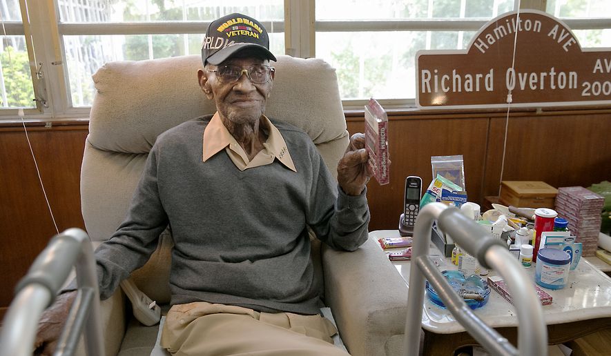 In this May 10, 2018 photo Richard Overton, the oldest living U.S. Veteran at the age of 111, is back in the east Austin home he has owned since 1948 after a renovation provided by Meals on Wheels of Central Texas and the Home Depot Foundation. A family member says Overton, the nations oldest World War II veteran who was also believed to be oldest living man in the U.S., has died in Texas. He was 112. Shirley Overton, whose husband was Richards cousin, says the Army veteran died Thursday, Dec. 27, 2018 at a rehab facility in Austin, Texas. (Ralph Barrera/Austin American-Statesman via AP, file)