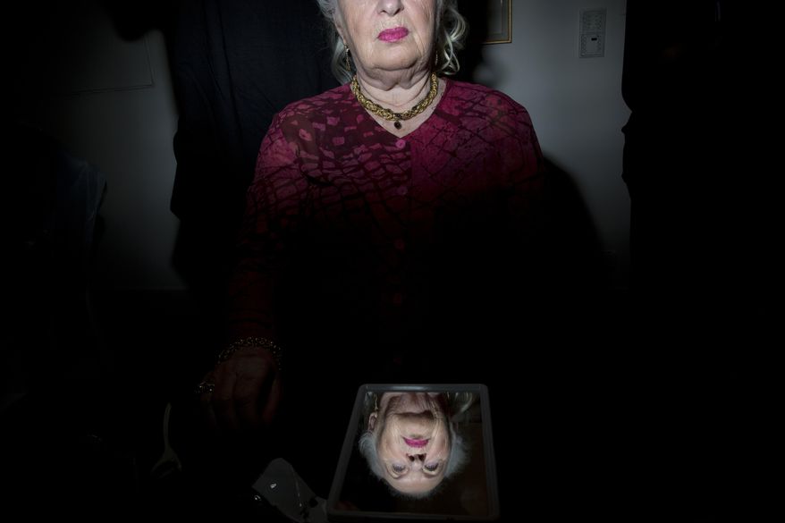 In this file photo, Holocaust survivor Galina Gurevitch, 82, has her hair done during a Beauty Heroines event in Ramat Gan, Israel, Monday, April 9, 2018. A new Israeli study found that Holocaust survivors tend to actually live longer compared to their peers in their age group that did not go through such a traumatic experience. (AP Photo/Oded Balilty) **FILE**
