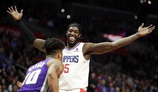 Los Angeles Clippers forward Montrezl Harrell celebrates after blocking a shot by Sacramento Kings guard Frank Mason III during the second half of an NBA basketball game in Los Angeles, Wednesday, Dec. 26, 2018. The Clippers won 127-118. (AP Photo/Chris Carlson)