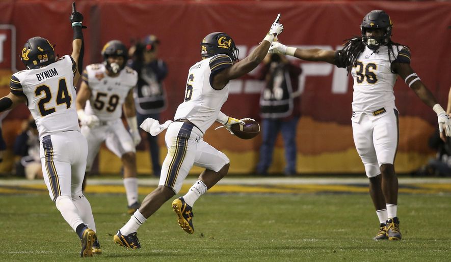 California safety Jaylinn Hawkins (6) celebrates his interception against TCU with linebacker Alex Funches (36) and cornerback Camryn Bynum (24) as linebacker Jordan Kunaszyk (59) watches during the first half of the Cheez-It Bowl NCAA college football game Wednesday, Dec. 26, 2018, in Phoenix. (AP Photo/Ross D. Franklin)