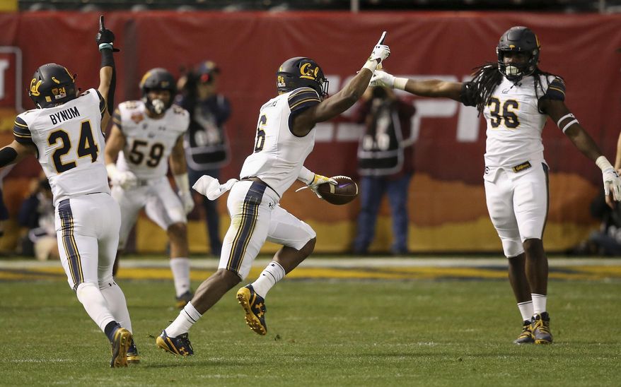California safety Jaylinn Hawkins (6) celebrates his interception against TCU with linebacker Alex Funches (36) and cornerback Camryn Bynum (24) as linebacker Jordan Kunaszyk (59) watches during the first half of the Cheez-It Bowl NCAA college football game Wednesday, Dec. 26, 2018, in Phoenix. (AP Photo/Ross D. Franklin)