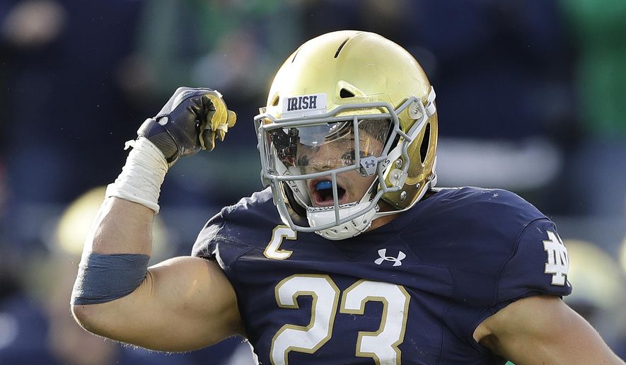 File-This Oct. 13, 2018, file photo shows Notre Dame linebacker Drue Tranquill celebrating after making a tackle during the second half of an NCAA college football game against Pittsburgh. Notre Dame defensive captain Tranquill and leading receiver Miles Boykin weren’t even Fighting Irish fans the last time they had a 12-0 regular season. Maybe that was a good thing since those current players didn’t have to suffer through how that season ended. (AP Photo/Darron Cummings, File) **FILE**