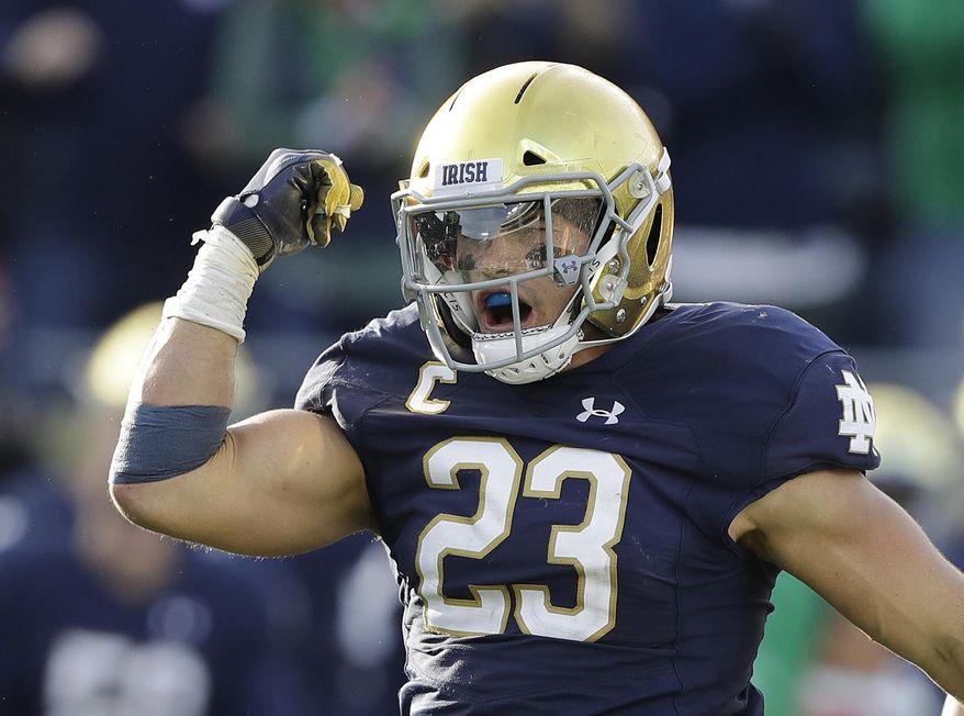 File-This Oct. 13, 2018, file photo shows Notre Dame linebacker Drue Tranquill celebrating after making a tackle during the second half of an NCAA college football game against Pittsburgh. Notre Dame defensive captain Tranquill and leading receiver Miles Boykin weren’t even Fighting Irish fans the last time they had a 12-0 regular season. Maybe that was a good thing since those current players didn’t have to suffer through how that season ended. (AP Photo/Darron Cummings, File) **FILE**