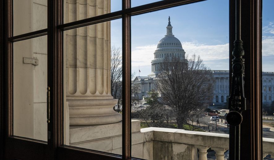 The Capitol Dome is seen from the Russell Senate Office Building in Washington, Thursday, Dec. 27, 2018, during a partial government shutdown.  Chances look slim for ending the partial government shutdown any time soon. Lawmakers are away from Washington for the holidays and have been told they will get 24 hours&#39; notice before having to return for a vote. (AP Photo/J. Scott Applewhite)