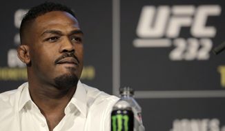 FILE - In this Nov. 2, 2018, file photo, Jon Jones talks in New York about his mixed martial arts light heavyweight bout against Alexander Gustafsson at UFC 232.  Jones is defiantly defending his role in the decision to move UFC 232 from Nevada to California on six days’ notice after he tested positive for low levels of a banned steroid. The former light heavyweight champion gave a passionate, occasionally bizarre performance Thursday at a news conference ahead of his title fight against Sweden’s Alexander Gustafsson at the Forum in Inglewood, Calif., on Saturday night. (AP Photo/Julio Cortez, File)