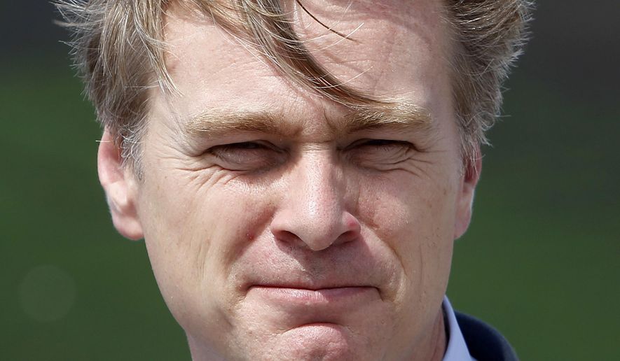 FILE - In this file photo dated Sunday, July 16, 2017, movie director Christopher Nolan poses at the premiere of the movie &amp;quot;Dunkirk,&amp;quot; in Dunkirk, northern France.  Nolan is among those being recognized in Britain’s royal New Year’s Honors List, according to the list of recipients released Friday Dec. 28, 2018. (AP Photo/Michel Spingler, FILE)