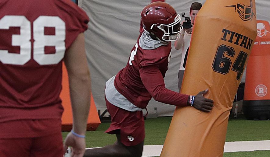 Oklahoma linebacker Kenneth Murray runs drills during an NCAA college football practice Thursday, Dec. 27, 2018, in Davie, Fla. Oklahoma plays Alabama in the Orange Bowl on Dec. 29. (AP Photo/Brynn Anderson)