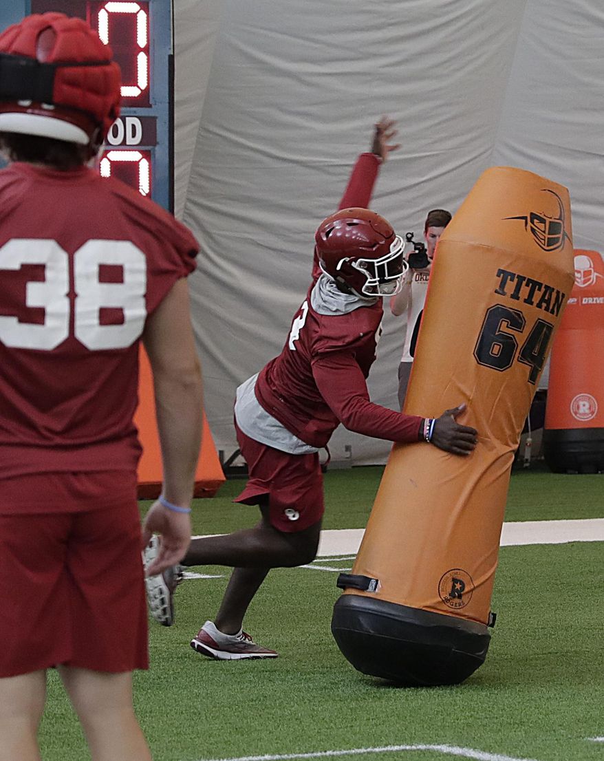 Oklahoma linebacker Kenneth Murray runs drills during an NCAA college football practice Thursday, Dec. 27, 2018, in Davie, Fla. Oklahoma plays Alabama in the Orange Bowl on Dec. 29. (AP Photo/Brynn Anderson)