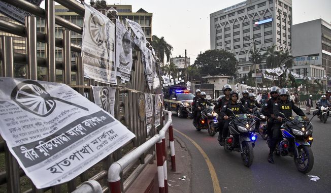 Bangladesh police&#x27;s elite Rapid Action Battalion (RAB) personnel patrol on motorcycles ahead of the general elections in Dhaka, Bangladesh, Friday, Dec. 28, 2018. Bangladesh Prime Minister Sheikh Hasina is poised to win a record fourth term in Sunday&#x27;s elections, drumming up support by promising a development bonanza as her critics question if the South Asian nation&#x27;s tremendous economic success has come at the expense of its already fragile democracy. (AP Photo/Anupam Nath)