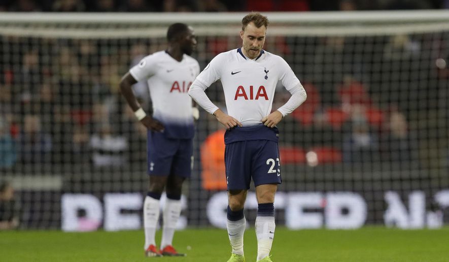 Tottenham Hotspur&#39;s Christian Eriksen, waits in the centre circle and looks down as he waits to restart the match after Wolverhampton Wanderers scored their 3rd goal during their English Premier League soccer match between Tottenham Hotspur and Wolverhampton Wanderers at Wembley stadium in London, Saturday, Dec. 29, 2018. (AP Photo/Kirsty Wigglesworth)