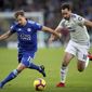 Leicester City&#x27;s Marc Albrighton, left, and Cardiff City&#x27;s Greg Cunningham during their English Premier League soccer match at the King Power Stadium in Leicester, England, Saturday Dec. 29, 2018. (Nick Potts/PA via AP)