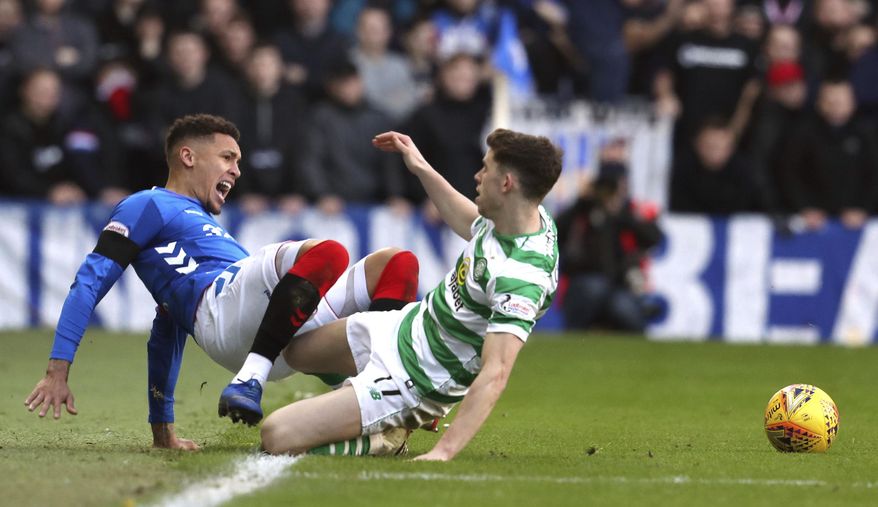 Rangers' James Tavernier, left, clashes with Celtic's Ryan Christie during their Scottish Premiership soccer match at Ibrox Stadium in Glasgow, Scotland, Saturday Dec. 29, 2018. (Andrew Milligan/PA via AP)