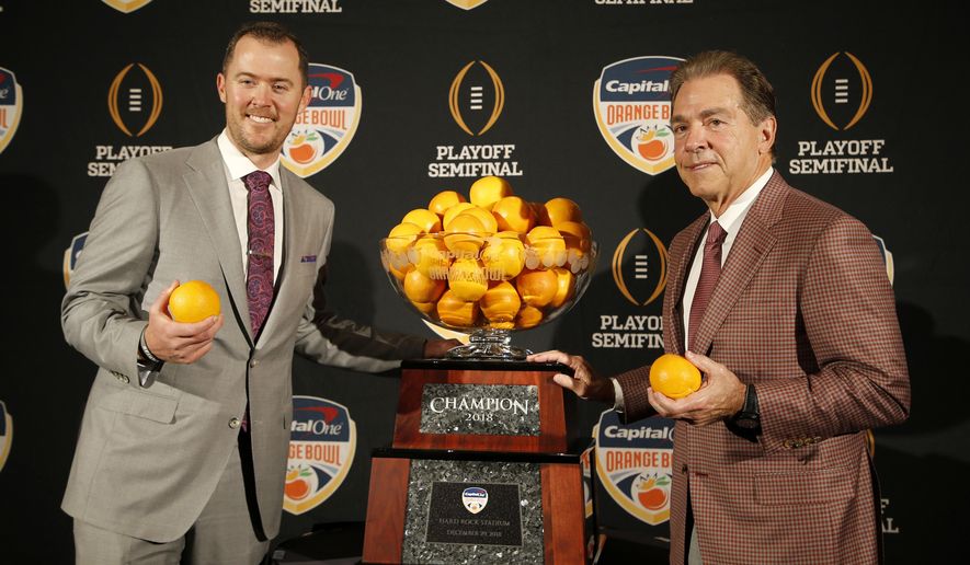Alabama head coach Nick Saban, right, stands with Oklahoma head coach Lincoln Riley at an NCAA college football news conference in Fort Lauderdale, Fla., Friday, Dec. 28, 2018. Alabama plays Oklahoma in the Orange Bowl on Saturday, Dec. 29. (AP Photo/Joe Skipper)