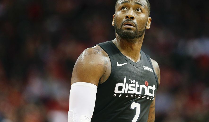 Washington Wizards guard John Wall walks off the court during a timeout during the second half of an NBA basketball game against the Houston Rockets, Wednesday, Dec. 19, 2018, in Houston. (AP Photo/Eric Christian Smith) ** FILE **