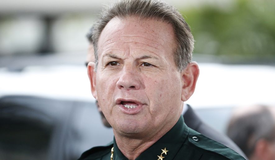 Broward County Sheriff Scott Israel speaks during a news conference at Fort Lauderdale–Hollywood International Airport, Friday, Jan. 6, 2017, in Fort Lauderdale, Fla. A gunman opened fire in the baggage claim area at the airport Friday, killing several people and wounding others before being taken into custody in an attack that sent panicked passengers running out of the terminal and onto the tarmac, authorities said. (AP Photo/Wilfredo Lee)
