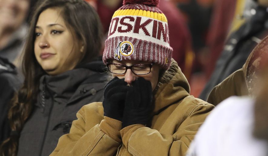 A Washington Redskins fans reacts in the closing minutes of the NFL football game between the Washington Redskins and the Philadelphia Eagles, Sunday, Dec. 30, 2018 in Landover, Md. The Eagles defeated the Redskins 24-0. (AP Photo/Andrew Harnik)