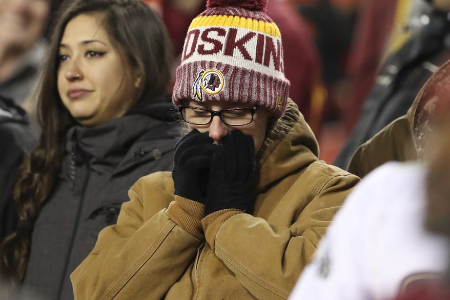 A Washington Redskins fans reacts in the closing minutes of the NFL football game between the Washington Redskins and the Philadelphia Eagles, Sunday, Dec. 30, 2018 in Landover, Md. The Eagles defeated the Redskins 24-0. (AP Photo/Andrew Harnik)