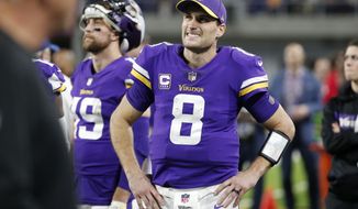 Minnesota Vikings quarterback Kirk Cousins (8) watches from the bench during the second half of an NFL football game against the Chicago Bears, Sunday, Dec. 30, 2018, in Minneapolis. (AP Photo/Bruce Kluckhohn)