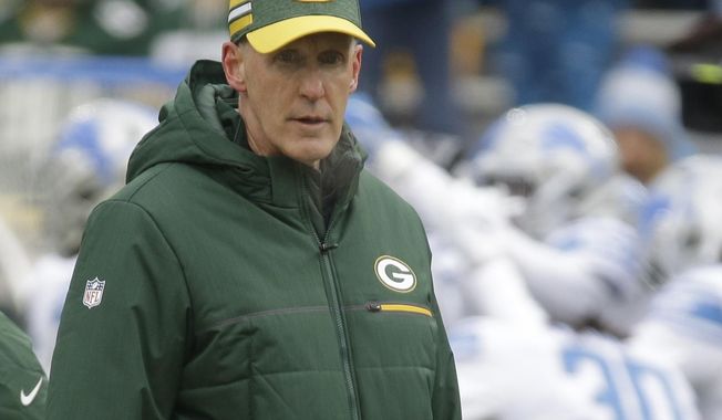 CORRECTS TO REMOVE SCORE- Green Bay Packers head coach Joe Philbin watches as players warm up before an NFL football game against the Detroit Lions Sunday, Dec. 30, 2018, in Green Bay, Wis. (AP Photo/Mike Roemer)