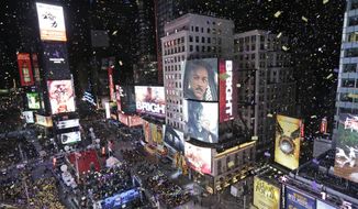 Confetti flies over Times Square during the New Year&#39;s celebration in New York. The New York Police Department is adding a drone this year to the security forces it uses to protect the huge crowds celebrating New Year&#39;s Eve in the city. (AP Photo/Seth Wenig, File)