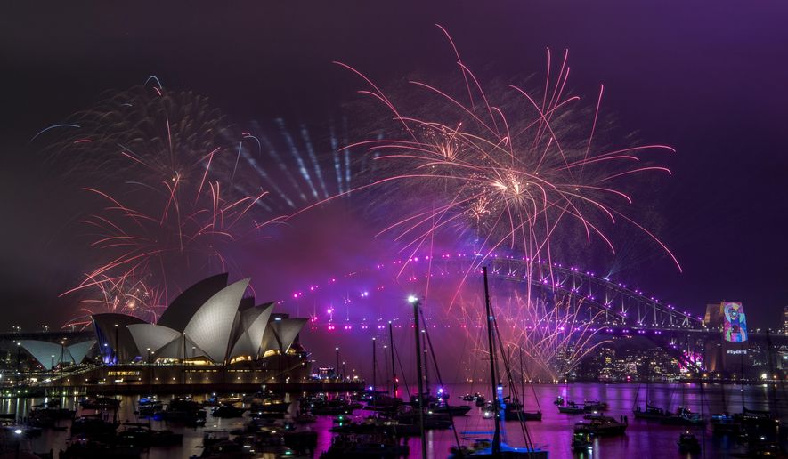 Fireworks explode over the Sydney Harbour during the New Year&#x27;s Eve celebrations in Sydney, Monday, Dec. 31, 2018. (Brendan Esposito/AAP Image via AP)