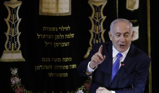 Israel&#39;s Prime Minister Benjamin Netanyahu speaks at the Kehilat Yaacov synagogue, in Rio de Janeiro, Brazil, Friday, Dec. 28, 2018. According to the Israeli Embassy, Netanyahu will stay in Rio until Tuesday, when he will travel to Brasilia for the presidential inauguration. (Leo Correa/Pool Photo via AP)