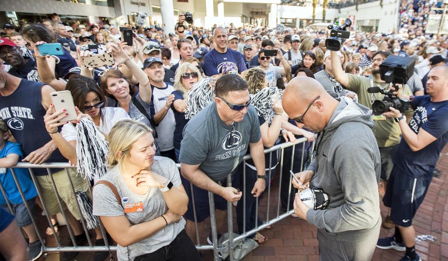 Penn State head coach James Franklin, front right, greets fans at a Citrus Bowl NCAA college football pep rally in Orlando, Fla., Monday, Dec. 31, 2018. (Joe Hermitt/The Patriot-News via AP)