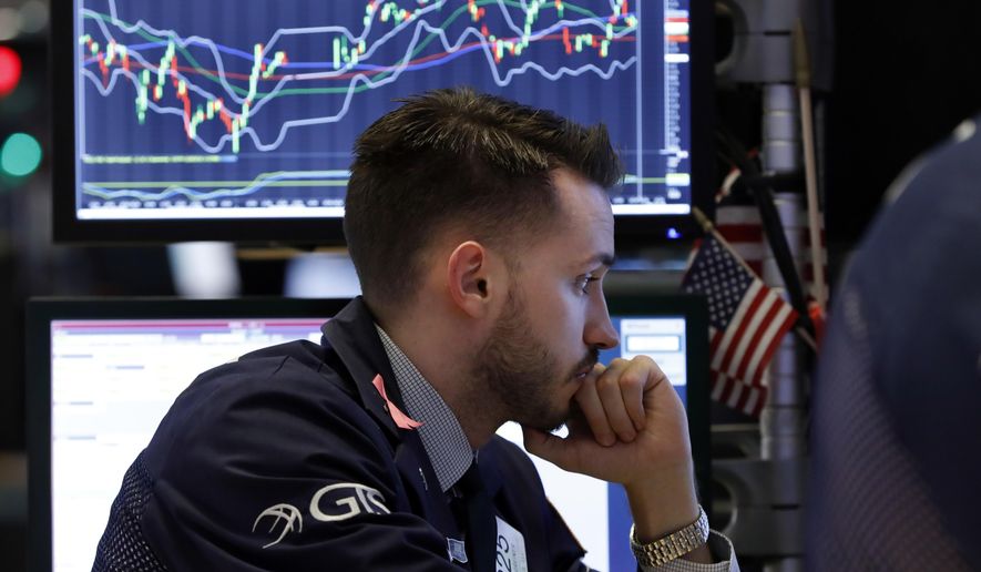 Specialist Matthew Greiner works at his post on the floor of the New York Stock Exchange, Friday, Dec. 28, 2018. U.S. stocks wavered between small gains and losses Friday, struggling to maintain the momentum from a two-day winning streak following a week of volatile trading. (AP Photo/Richard Drew)