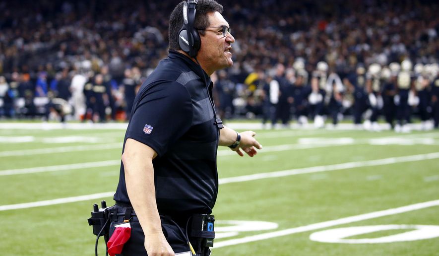 Carolina Panthers head coach Ron Rivera calls out from the sideline in the first half of an NFL football game against the New Orleans Saints in New Orleans, Sunday, Dec. 30, 2018. (AP Photo/Butch Dill)