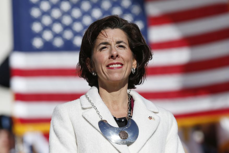 Rhode Island Gov. Gina Raimondo stands on the State House steps after taking the oath of office in Providence, R.I., Tuesday, Jan. 1, 2019. Raimondo was sworn into a second term in office, promising to continue bringing change to set the state on a "path for enduring success." (AP Photo/Michael Dwyer)