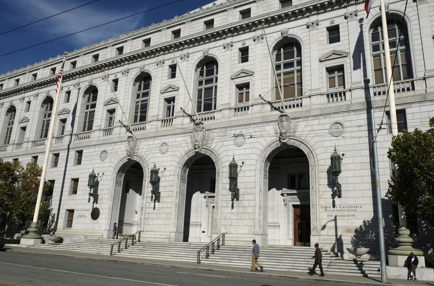 CORRECTS TO JAN. 2, 2019-File - In this Nov. 2, 2018, file photo, people walk past the Earl Warren Building that houses the California Supreme Court in San Francisco. The California Supreme Court has denied a last-minute challenge to a state law opening police records to the public. The justices on Wednesday, Jan. 2, 2019, denied an appeal saying that the law should apply only to incidents that happen after the law took effect Tuesday. The law was written partly in response to fatal police shootings of unarmed minority men. (AP Photo/Eric Risberg, File)