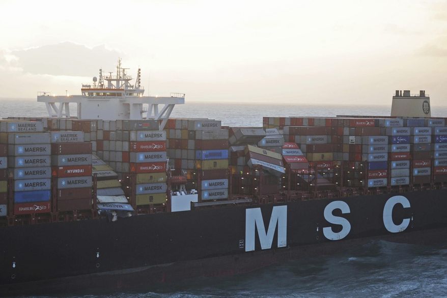 Aerial photo provided by the Central Command for Maritime Emergencies Germany shows container vessel MSC ZOE near the German North Sea island of Borkum Wednesday, Jan. 2, 2019. The Dutch coast guard said that along with light bulbs, toys and flat screens, some of the containers carried closed-off barrels of an organic peroxide, a flammable and highly toxic compound. The container ship is suspected to have lost the cargo during an overnight storm in waters off the coastal border between Germany and the Netherlands. (Central Command for Maritime Emergencies Germany/dpa via AP)