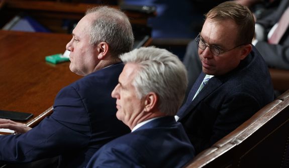 White House Chief of Staff Mick Mulvaney, right, talks with Rep. Kevin McCarthy of Calif., center and Rep. Steve Scalise, R-La., before House Democratic Leader Nancy Pelosi of California is sworn in a House Speaker at the U.S. Capitol in Washington, Thursday, Jan. 3, 2019. (AP Photo/Carolyn Kaster)