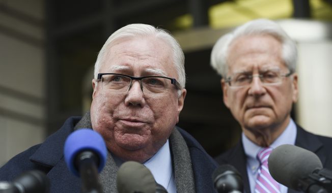 Jerome Corsi, left, speaks during a news conference as his lawyer Larry Klayman stands behind him outside the federal courthouse in Washington, Thursday, Jan. 3, 2019. (AP Photo/Sait Serkan Gurbuz) 