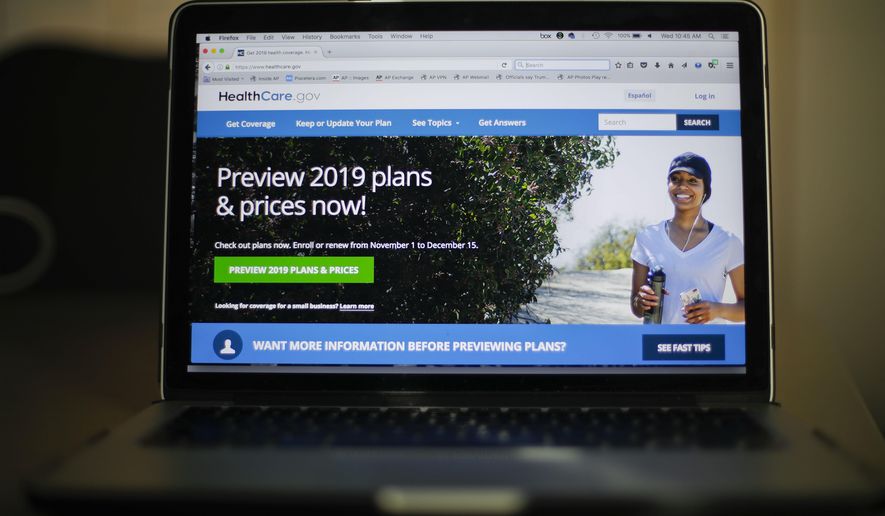 FILE - In this Oct. 31, 2018, file photo, the HealthCare.gov website is photographed in Washington. The government says 8.4 million Americans have signed up for coverage next year under the Obama health law, even as supporters of the law appealed a court ruling declaring it unconstitutional. (AP Photo/Pablo Martinez Monsivais, File)
