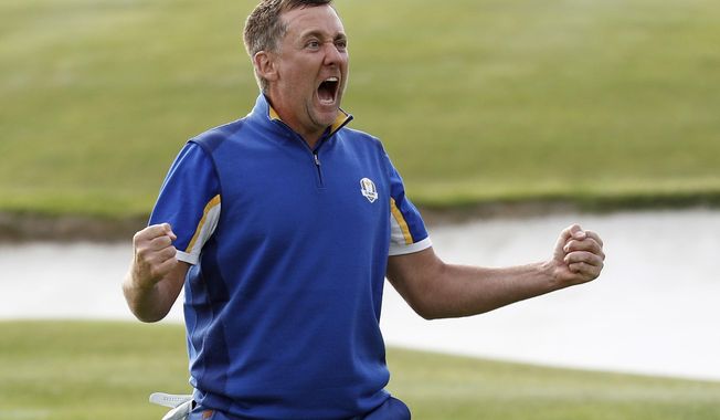FILE - In this Sept. 30, 2018, file photo, Europe&#x27;s Ian Poulter celebrates after defeating Dustin Johnson of the United States during a singles match on the final day of the 42nd Ryder Cup at Le Golf National in Saint-Quentin-en-Yvelines, France. Poulter is in Hawaii to start the new year, part of a bizarre set of circumstances where winning caused him to add two tournaments to his schedule. (AP Photo/Laurent Cipriani, File)