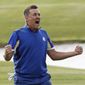 FILE - In this Sept. 30, 2018, file photo, Europe&#39;s Ian Poulter celebrates after defeating Dustin Johnson of the United States during a singles match on the final day of the 42nd Ryder Cup at Le Golf National in Saint-Quentin-en-Yvelines, France. Poulter is in Hawaii to start the new year, part of a bizarre set of circumstances where winning caused him to add two tournaments to his schedule. (AP Photo/Laurent Cipriani, File)
