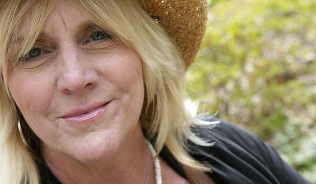 FILE - In this April 17, 2007 file photo, singer Pegi Young is photographed in New York&#x27;s Central Park.  Young, who with fellow musician and then-husband Neil Young helped found the Bridge School for children with speech and physical impairments, has died. Young died of cancer Tuesday, Jan. 1, 2019, in California, according to spokeswoman Michelle Gutenstein-Hinz. She was 66.  (AP Photo/ Jim Cooper, File)