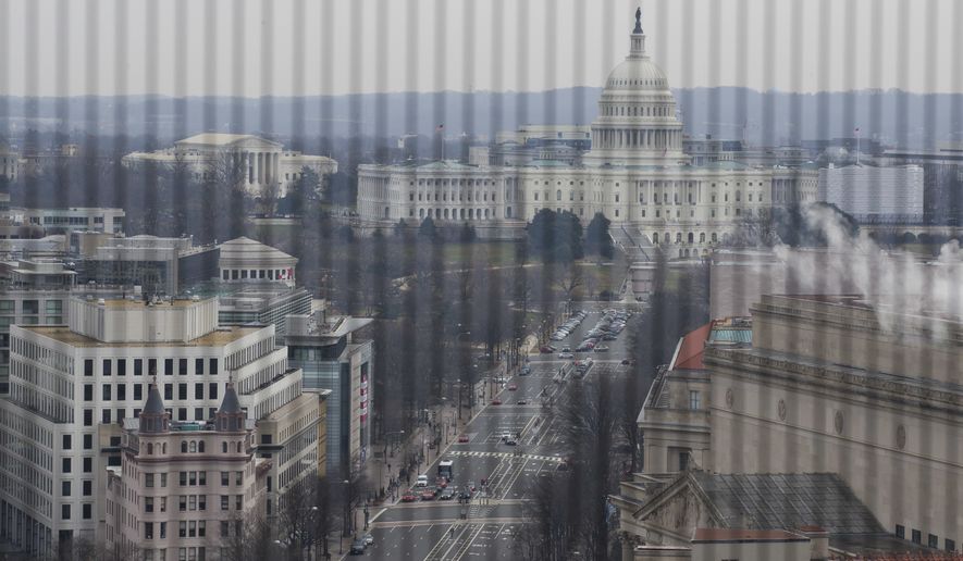 Pennsylvania Avenue leads to the U.S. Capitol seen from the Old Post Office Pavilion Clock Tower, which remains open during the partial government shutdown, Friday, Jan. 4, 2019 ,in Washington. (AP Photo/Alex Brandon) **FILE**