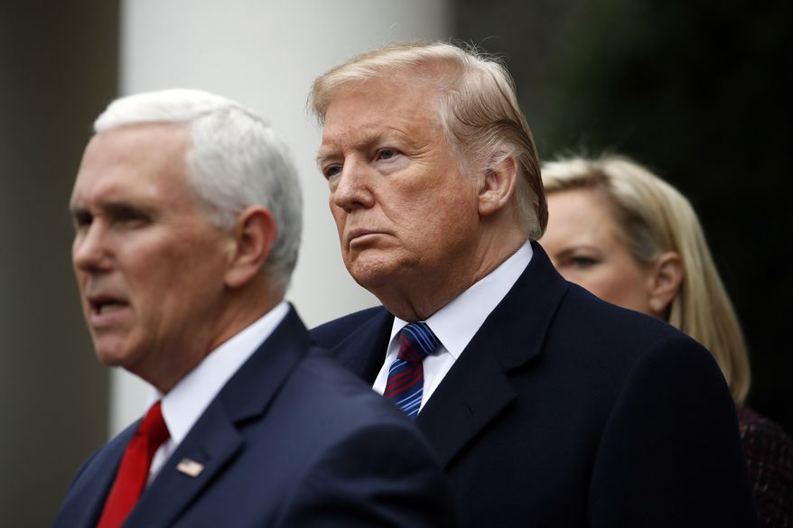 President Donald Trump listens as Vice President Mike Pence speaks in the Rose Garden of the White House after a meeting with Congressional leaders on border security, Friday, Jan. 4, 2019, at the White House in Washington, as Homeland Security Secretary Kirstjen Nielsen listens at right. (AP Photo/Jacquelyn Martin)