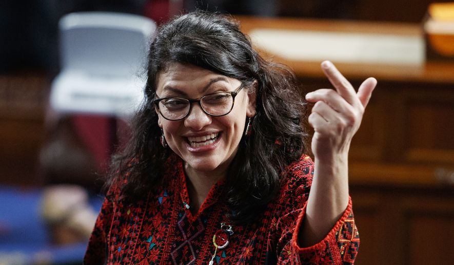 In this Thursday, Jan. 3, 2019, photo, then Rep.-elect Rashida Tlaib of Michigan, is shown on the house floor before being sworn into the 116th Congress at the U.S. Capitol in Washington. (AP Photo/Carolyn Kaster)