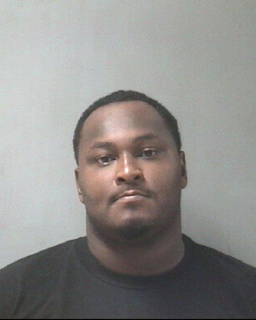 This Jan. 3, 2019 booking photo released by Texas City Police Department shows Junaid Hashim Mehmood. Police say Mehmood, a person of interest in the fatal shooting of three children and the wounding of a woman at an apartment in Southeast Texas has been arrested on an unrelated warrant. Texas City Police say 27-year-old Mehmood surrendered to police Thursday, Jan. 3, 2019. (Texas City Police Department via AP)