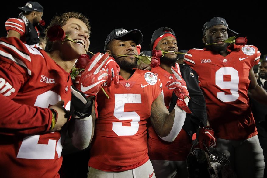 Ohio State players celebrate after a 28-23 win over Washington in the Rose Bowl NCAA college football game Tuesday, Jan. 1, 2019, in Pasadena, Calif.(AP Photo/Jae C. Hong)