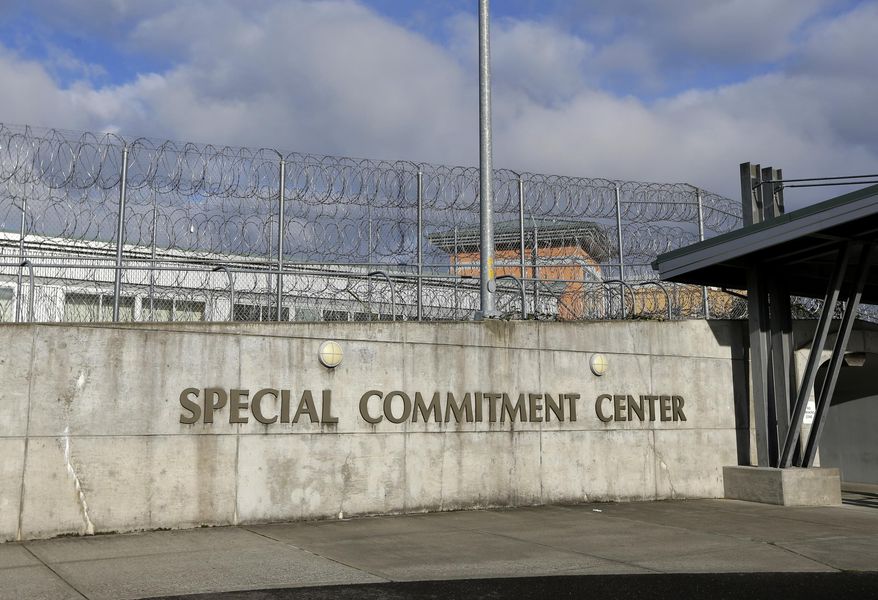 FILE - This Oct. 20, 2015, file photo, shows the main entrance to Washington state's Special Commitment Center next to a fence lined with razor wire on McNeil Island, Wash. State officials say a sexually violent predator being held at the Special Commitment Center died after suffering a head injury during a fight with another resident. Chris Wright, with the Department of Social and Health Services, said Friday, Jan. 4, 2019, 63-year-old Jerry Spicer suffered a head injury during the fight on Thursday in the facility's cafeteria. (AP Photo/Ted S. Warren, File)